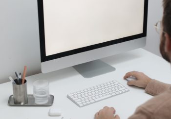 Free Crop man working on computer in workplace Stock Photo