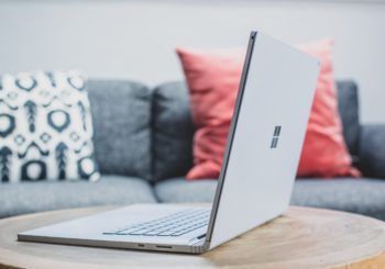 macbook pro on white couch