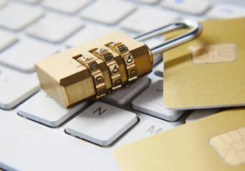 a golden padlock sitting on top of a keyboard